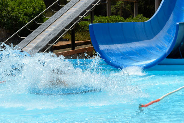 istock people ride water slides in the water park 1004259444