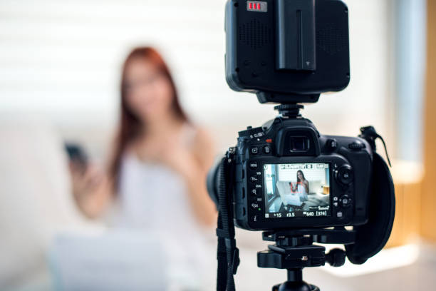 istock Young female vlogger recording a make-up video for her vlog. 1004263594