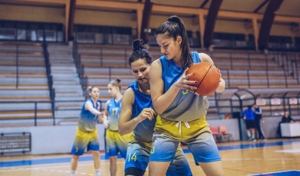 istock Women playing basketball game 1004266550
