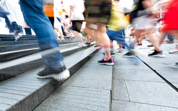 istock Human legs going up the stairs 1004266900