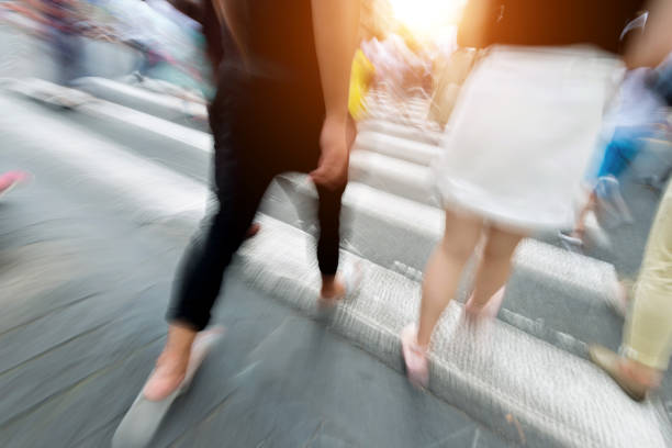 istock Group of people walking on crosswalk 1004268086