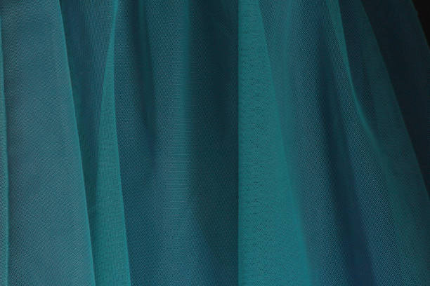Closeup of teal tulle tutu skirt Close up of a pretty teal tulle tutu skirt ballerina shadow stock pictures, royalty-free photos & images