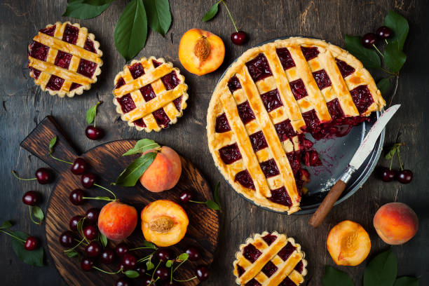 istock Homemade cherry pie on rustic wooden background 1004277144