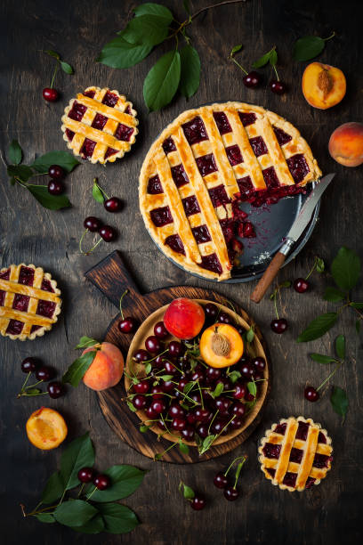 istock Homemade cherry pie on rustic wooden background 1004277148