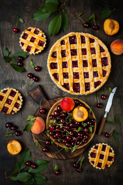istock Homemade cherry pie on rustic wooden background 1004277170