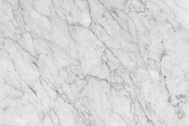 istock Detailed structure of white marble in natural gray patterned for background and interior design. 1004277250