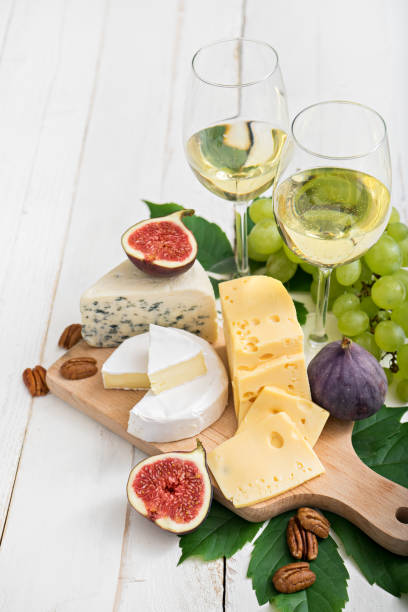 istock food background with wine, figs, cheeses, grape 1004278190