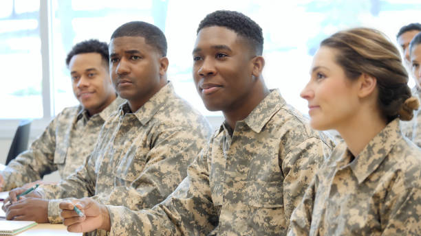 istock Young military cadet enjoys classroom training 1004304340