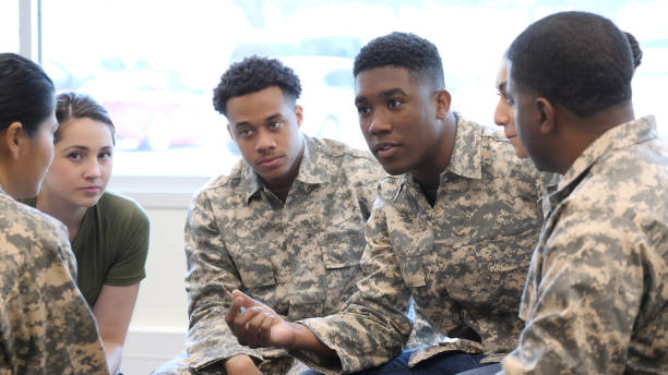 istock Military recruits in intense training class discussion 1004304344