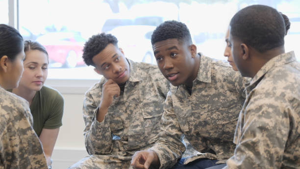 istock Group of new military recruits in training class discussion 1004304426