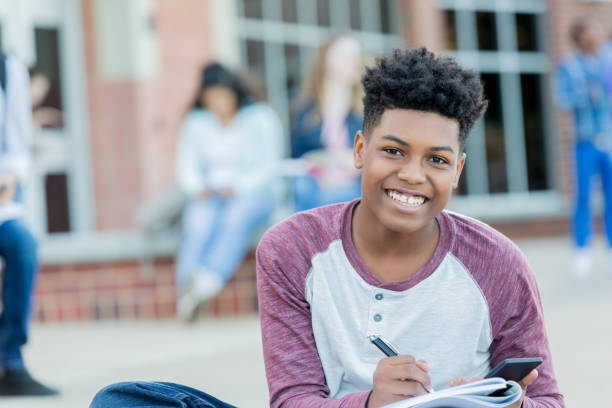 istock Smiling African American high school boy 1004308920