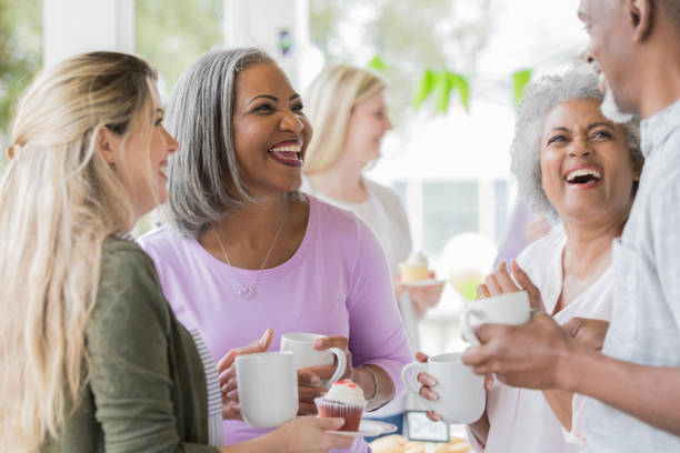 istock Friends laughing together at charity event 1004309214