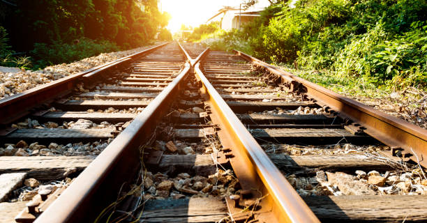 istock Crossroad railroad track at sunset 1004309852