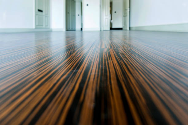istock White empty room with wooden floor and door 1004341094