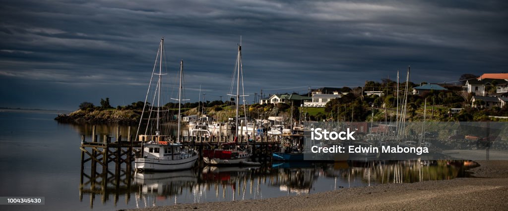 Fishing boats Fishing boats waiting for the tide to come in New Zealand Stock Photo