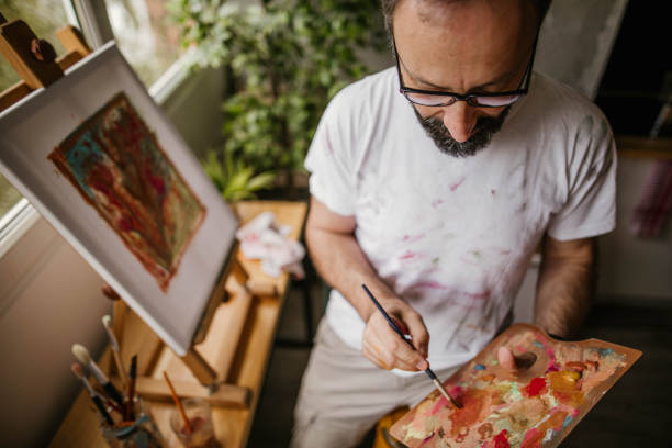 istock Mature artist on his art studio 1004348878