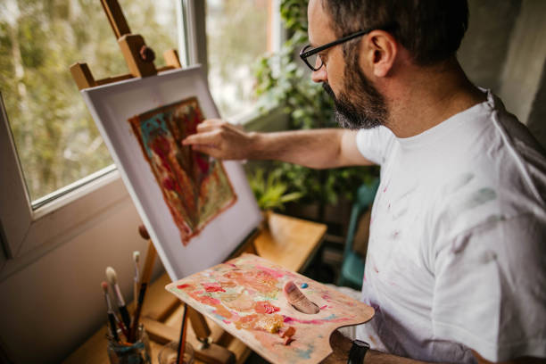 istock Mature artist on his art studio 1004348918