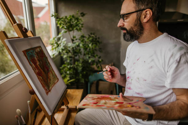 istock Mature artist on his art studio 1004348956