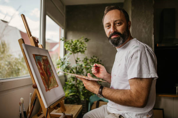 istock Mature artist on his art studio 1004349078