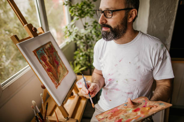 istock Mature artist on his art studio 1004349100