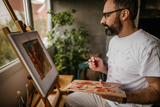 istock Mature artist on his art studio 1004349106
