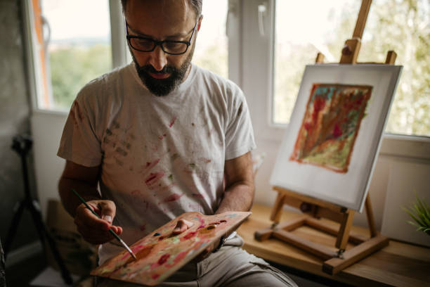 istock Mature artist on his art studio 1004349128