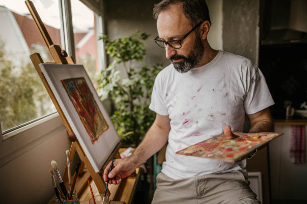istock Mature artist on his art studio 1004349238