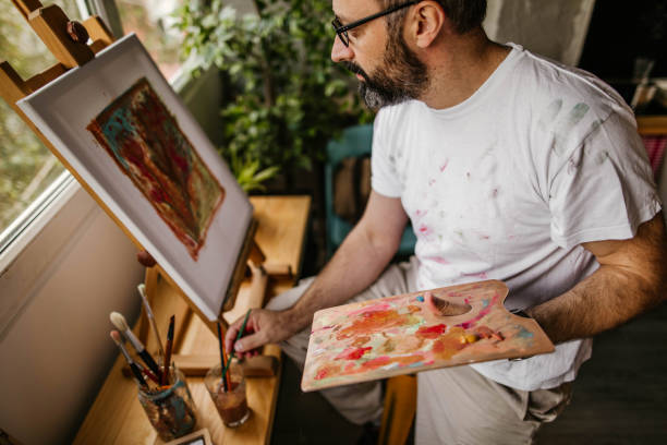 istock Mature artist on his art studio 1004349768