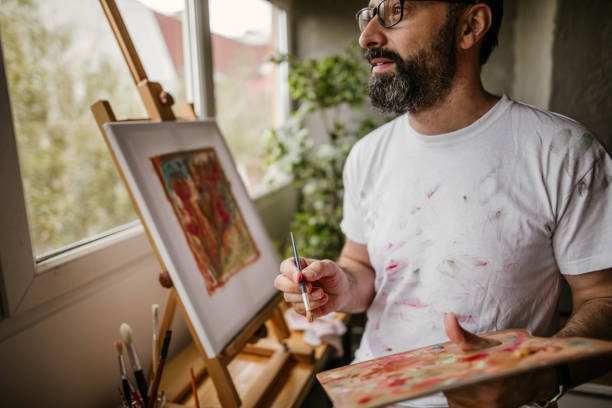 istock Mature artist on his art studio 1004350816