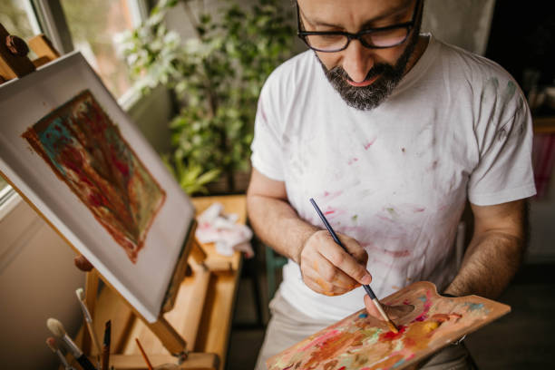 istock Mature artist on his art studio 1004351844