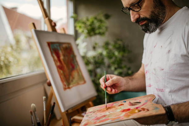 istock Mature artist on his art studio 1004351932