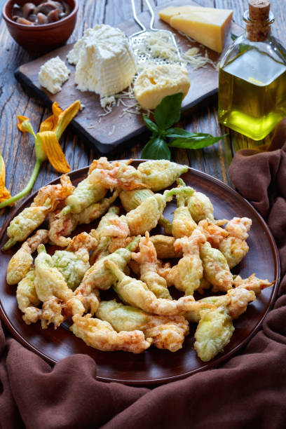 istock deep fried zucchini flowers on a plate 1004363294