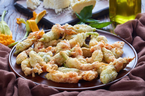 istock deep fried zucchini flowers on a plate 1004363364