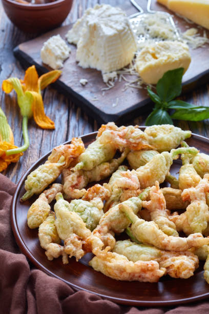 istock deep fried zucchini flowers on a plate 1004363436