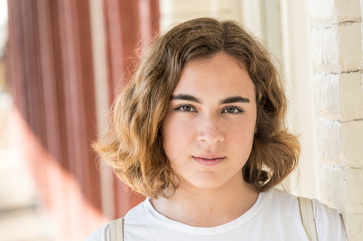 Serious caucasian young woman looking at the camera