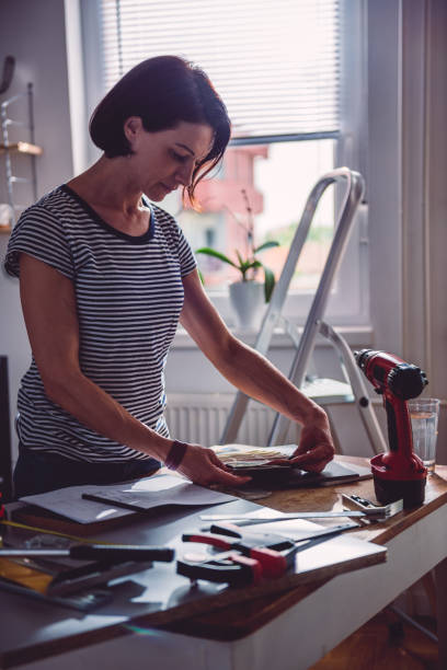 istock Woman checking color swatch 1004384156