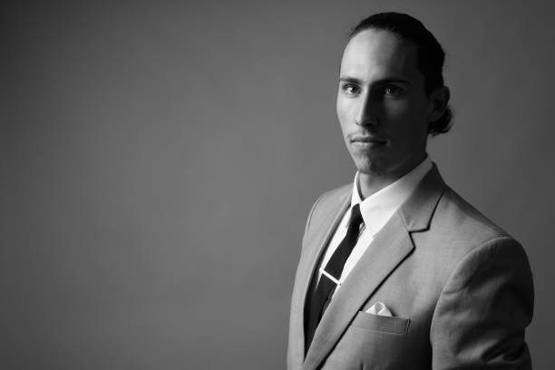 istock Young handsome businessman in black and white 1004387588
