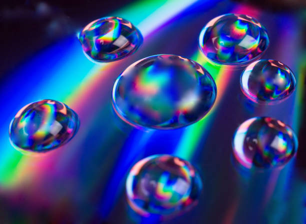 istock Soft focus blurred drops of liquid in neon colors 1004399414