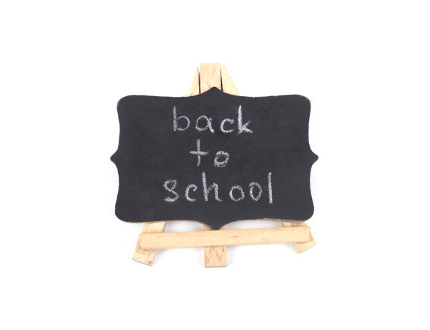 istock Blackboard with Back to School words isolated on white 1004405714