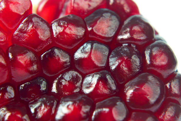 istock peeled pomegranate fruit closeup on white background 1004412028