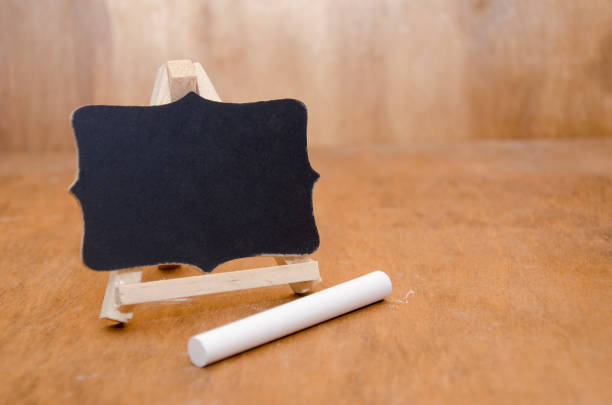 istock Little blackboard and a piece of white chalk 1004418438
