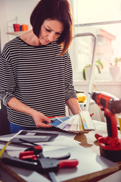 istock Woman checking color swatch 1004434944