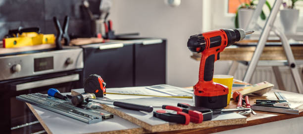 Kitchen renovation mess Kitchen renovation mess with blueprints and tools power tool photos stock pictures, royalty-free photos & images