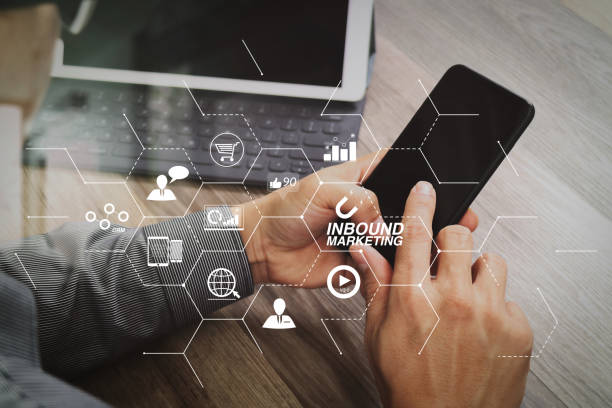 istock Hand using mobile payments online shopping,omni channel,icon customer network,in modern office wooden desk, blank interface screen,filter effect 1004441222