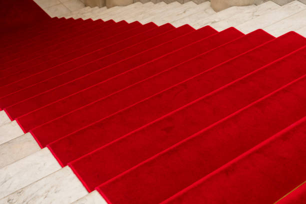 istock Red carpet on stairway 1004444660