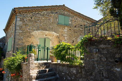 View of the terrace of an old stone house in the medieval village of Balazuc in southern France