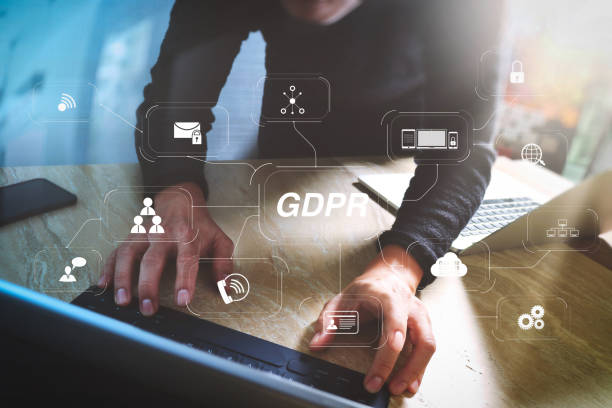 istock Website designer working digital tablet dock keyboard and computer laptop with smart phone and graphics design diagram on mable desk as concept 1004459366
