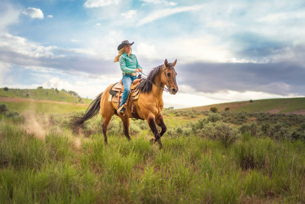 istock Cowgirl Horseback Riding 1004459724