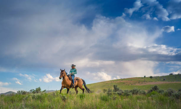 istock Cowgirl Horseback Riding 1004459880