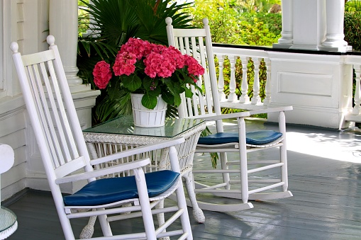 southern porch with rocking chairs and flowers